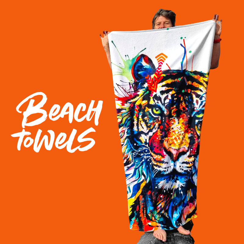 Sarah holding a towel covered in her tiger painting