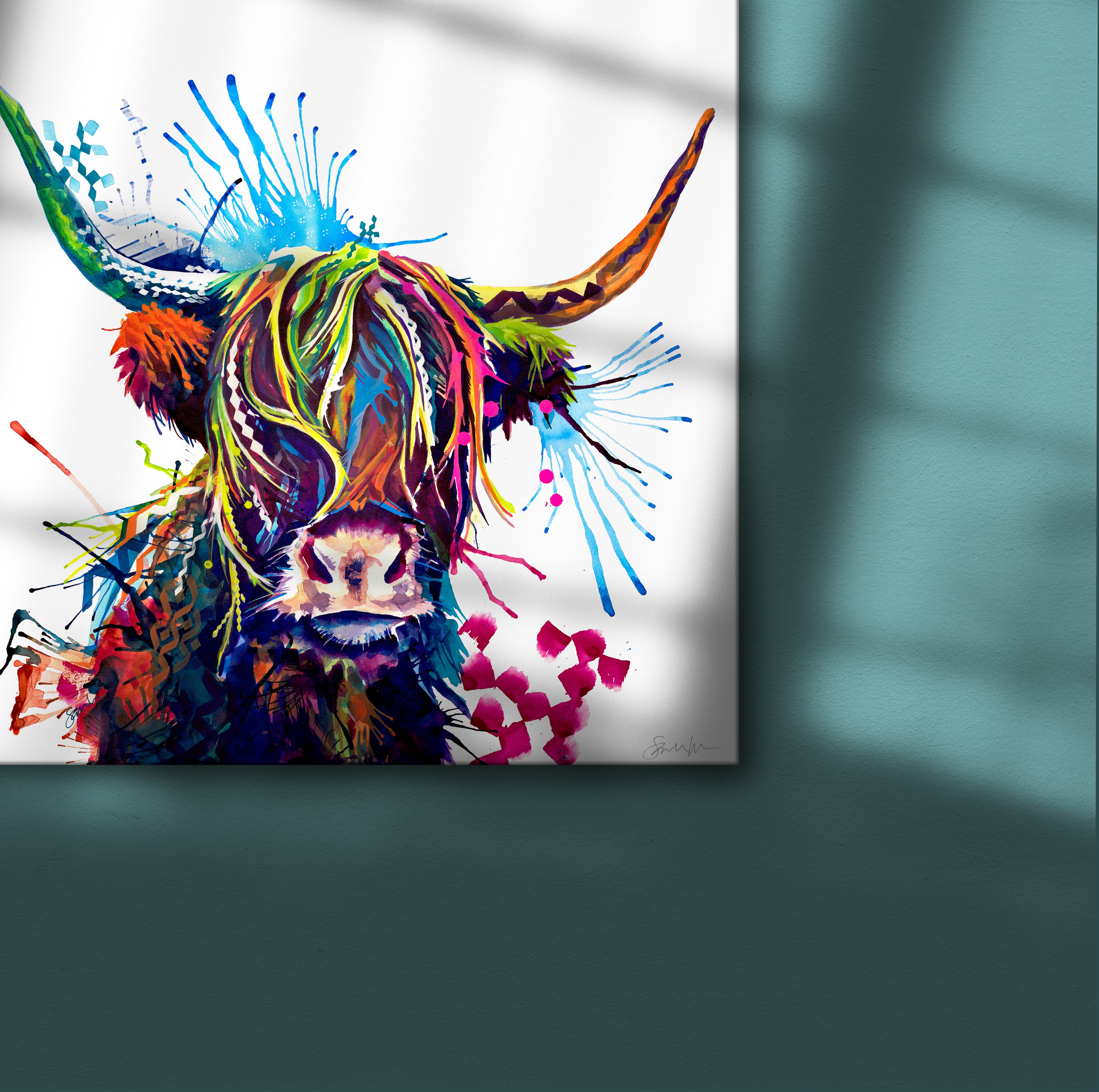Colourful highland cow canvas art on green wall