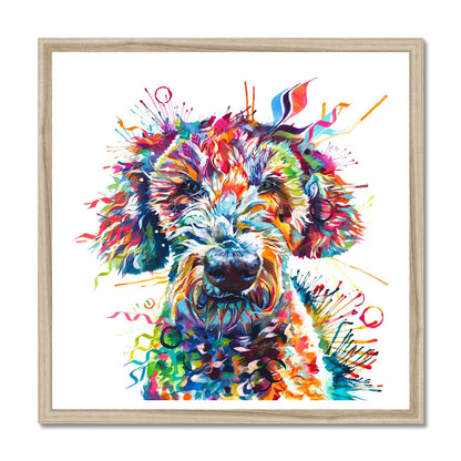 Colourful framed Labradoodle wall art print featuring Basil the Labradoodle in vibrant pink, orange, blue, and rainbow tones by Sarah Taylor Art. Natural wood frame.