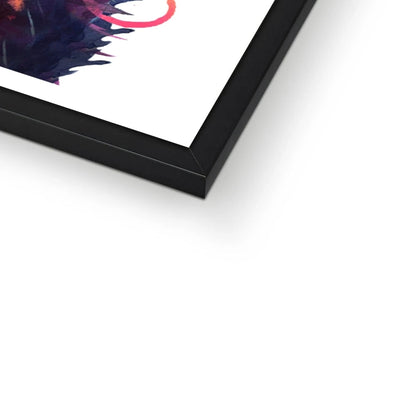 Framed print of Merlin, a colourful black cat painting with glowing green eyes and streaks of pink, violet and blue