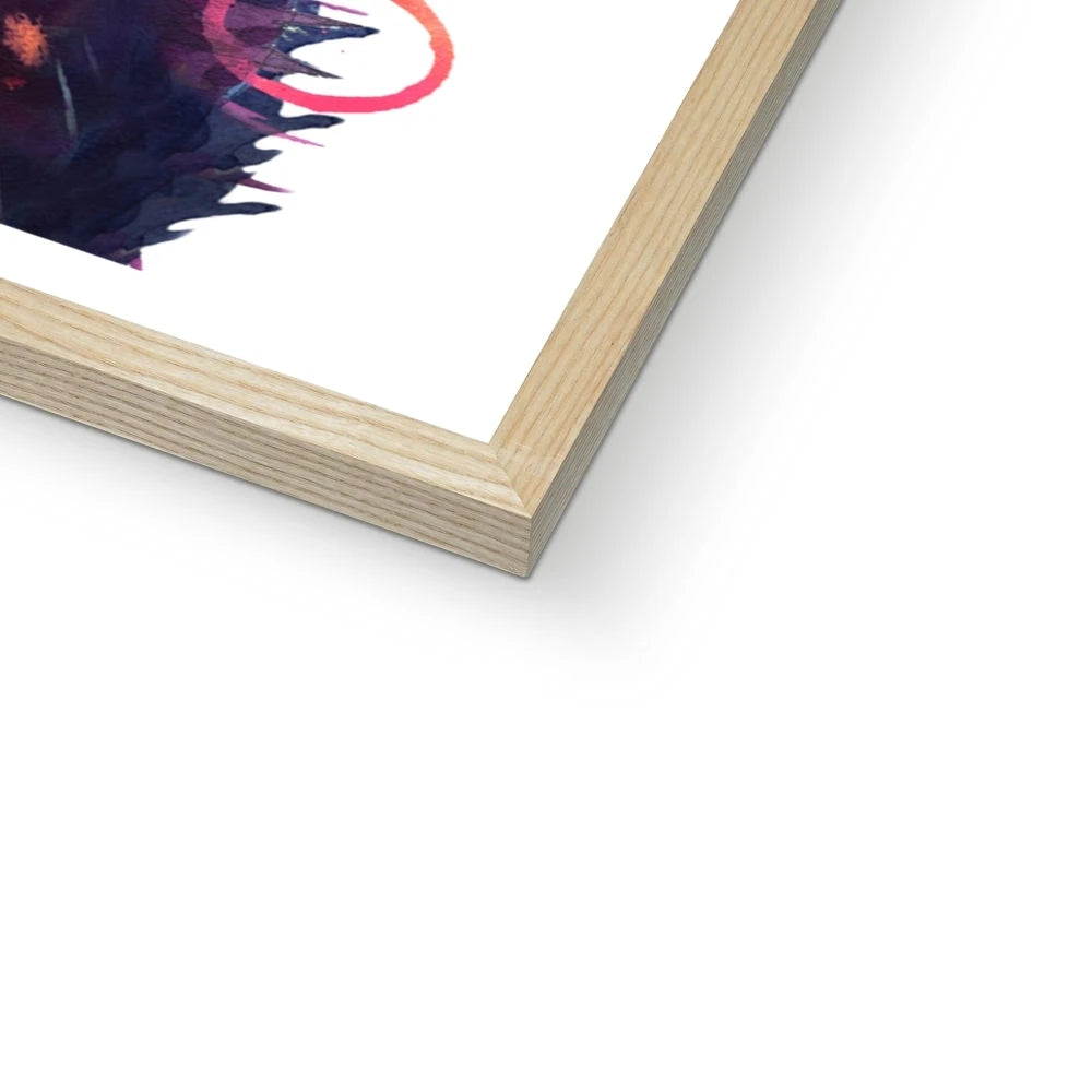 Framed print of Merlin, a colourful black cat painting with glowing green eyes and streaks of pink, violet and blue